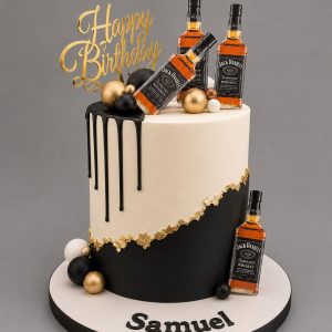 Black and gold whiskey themed birthday cake with bottle decorations