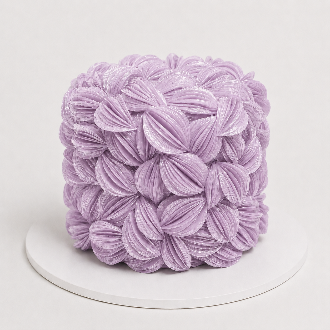 Luxury Lavender wafer paper petal statement cake with textured floral wafer paper design on a white cake board